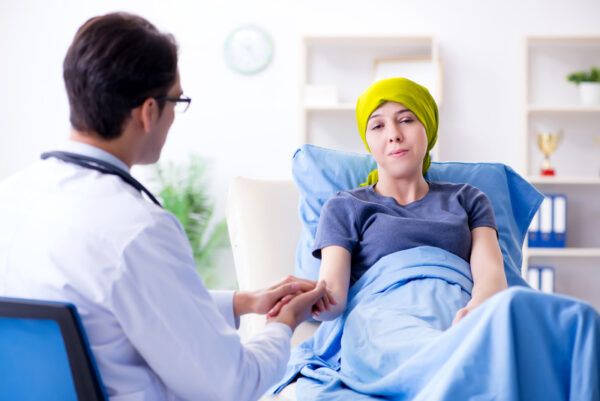 Cancer patient visiting doctor for medical consultation in clinic